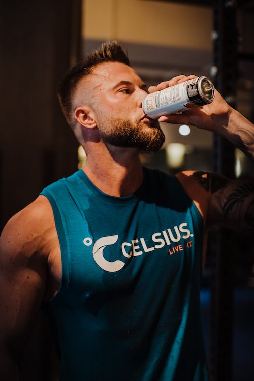 image of a man in celsius apparel drinking a celsius