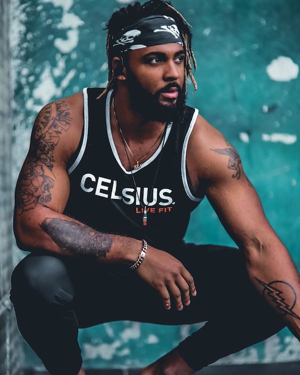 image of a man squatting in celsius apparel